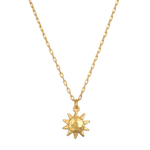 Here Comes the Sun Necklace featuring a hammered 18kt gold plated sun pendant on a delicate chain, embodying the meaning of vitality and leadership. This spiritual jewelry is perfect for meditation and manifestation, resonating with the sun's powerful energy. Ideal for yoga enthusiasts seeking meaningful talismans.