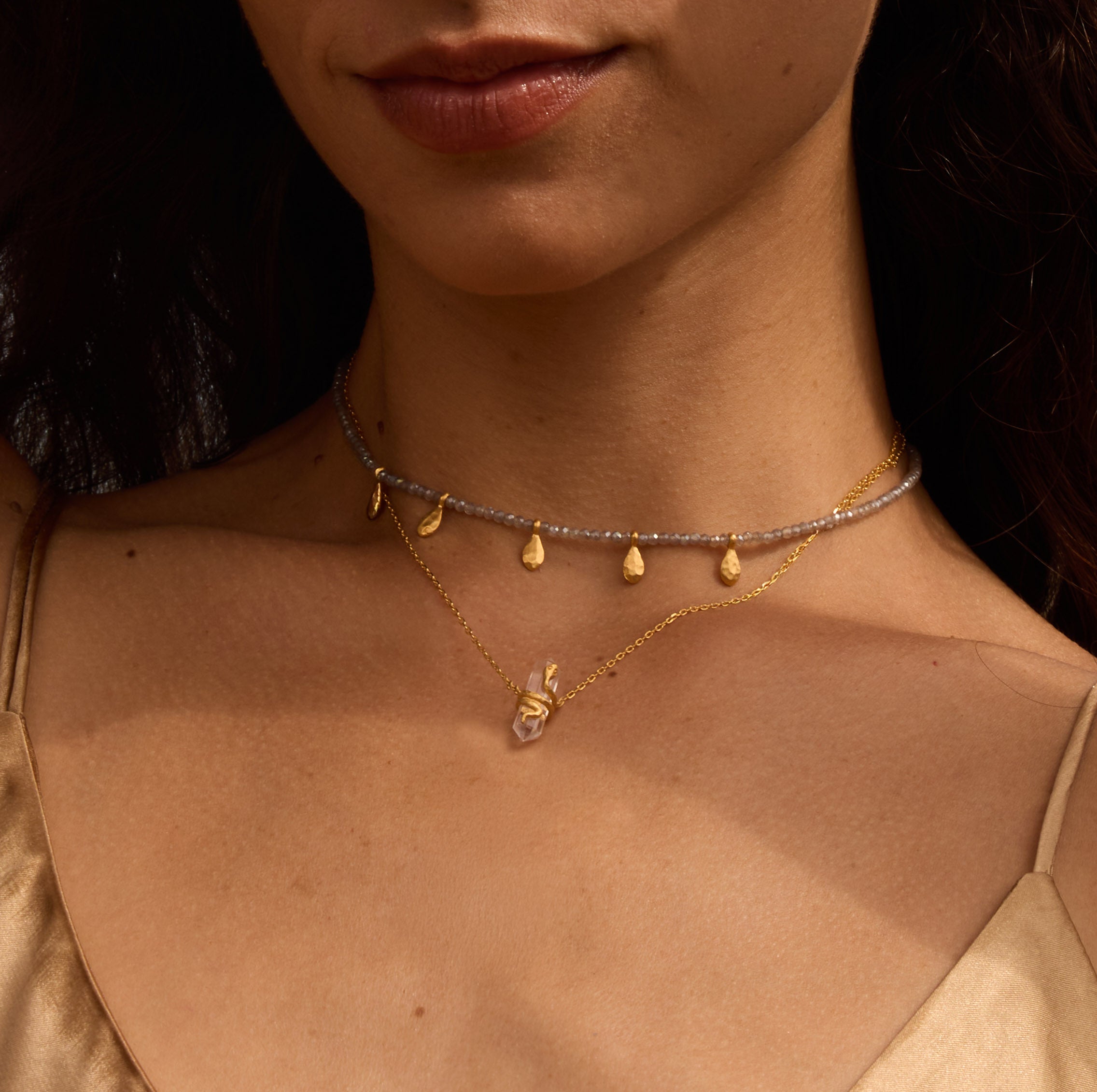 Model wearing the Inspired Beginnings Labradorite Petal Beaded Necklace layered with other delicate necklaces, showcasing spiritual jewelry that enhances intuition and meaning, perfect for yoga and meditation practices.