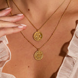 Layered necklaces showcasing the Joyful Beginnings Necklace, with its gold lotus pendant and white topaz, embodying a sense of elegance and spiritual connection, ideal for yoga, manifestation, and talisman wearers.