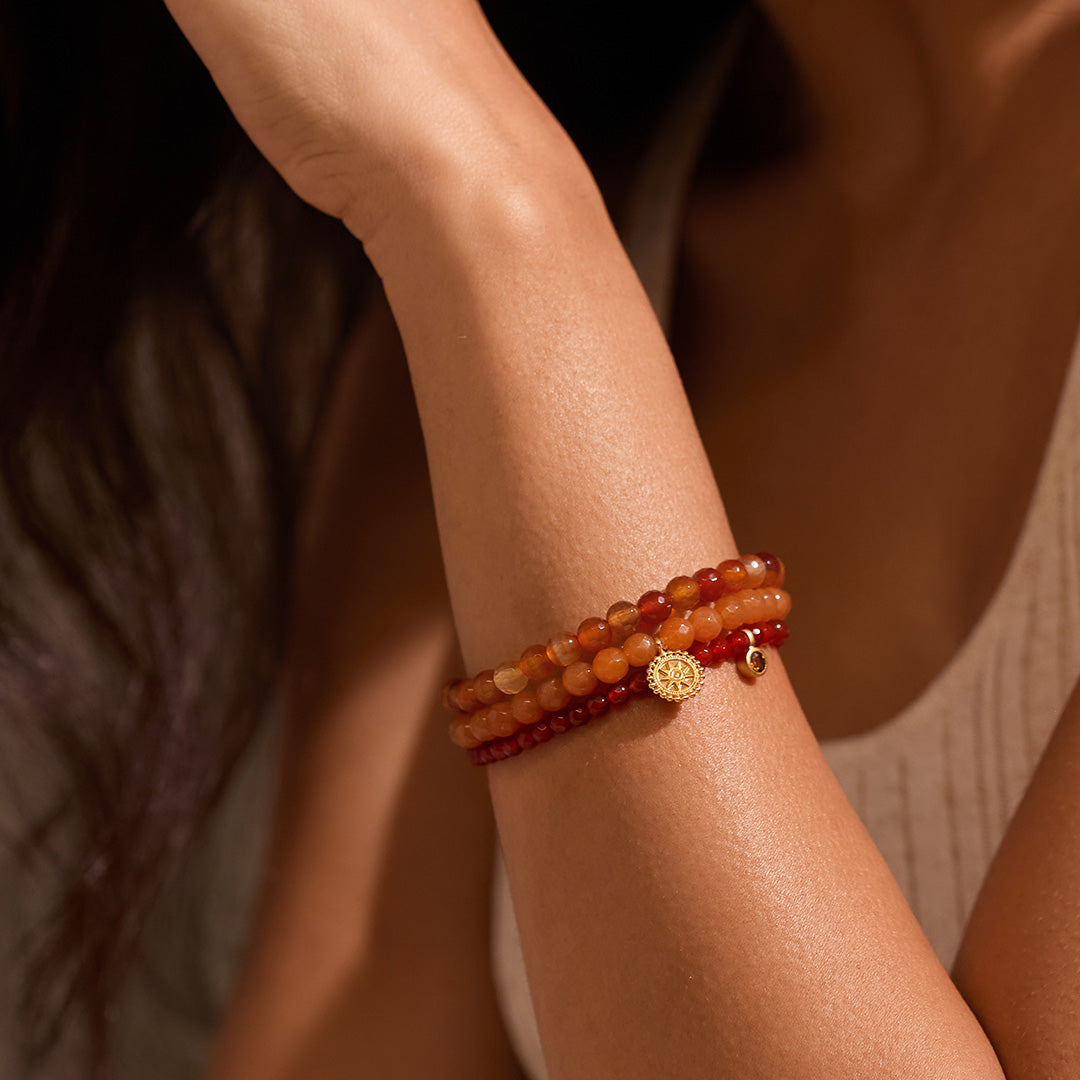 Close-up of the Manifest Protection Gemstone Bracelet Set worn elegantly on a woman's wrist, highlighting its unique gemstones and intricate design. This spiritual jewelry symbolizes inner peace and acts as a meditation talisman, making it a meaningful accessory for yoga and manifestation practices.
