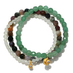 Manifest Peace Gemstone Bracelet Set featuring vibrant green aventurine, fancy jasper, and new jade beads, designed for spiritual jewelry enthusiasts seeking tranquility, protection, and meaningful meditation experiences. Adorned with sun and moon charms, this talisman promotes manifestation and is perfect for yoga practitioners.