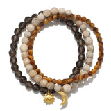 Manifest Balance Gemstone Bracelet Set featuring African opal, smokey quartz, and tiger eye beads, ideal for spiritual jewelry and meditation practices that enhance protection and meaning. Perfect for yoga enthusiasts and zodiac lovers, these malas serve as talismans for manifestation, inspired by celestial elements of the sun and moon.