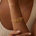 Close-up of the Expanding Beauty Lotus Cuff on a wrist, illustrating its delicate craftsmanship and significance as a meaningful piece of spiritual jewelry, ideal for manifestation and yoga.