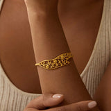 Close-up of the Expanding Beauty Lotus Cuff on a wrist, illustrating its delicate craftsmanship and significance as a meaningful piece of spiritual jewelry, ideal for manifestation and yoga.
