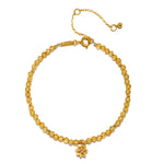 Citrine Lotus November Birthstone Bracelet featuring a delicate 18kt gold plated lotus flower pendant, representing new beginnings. This spiritual jewelry combines elements of meditation and manifestation with its radiant citrine stones, making it a meaningful talisman for those born in November. Ideal for yoga enthusiasts seeking protection and positivity, this bracelet embodies the essence of the sun and moon.