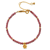 Pink Tourmaline Lotus October Birthstone Bracelet featuring round pink tourmaline beads with an 18kt gold plated lotus flower pendant. This spiritual jewelry piece embodies creativity and inspiration, making it a meaningful talisman for meditation and manifestation. Ideal for yoga enthusiasts and those seeking spiritual protection, this bracelet symbolizes new beginnings and aligns with zodiac energies.