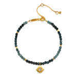 Channeling Wisdom Sapphire Starburst Beaded Bracelet featuring delicate sapphire beads and an 18kt gold plated starburst charm. This piece of spiritual jewelry is perfect for meditation, talisman wearers, and those interested in zodiac meanings and manifestation.