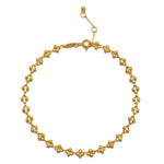 Gold-tone chain bracelet with decorative beaded links and adjustable clasp closure.