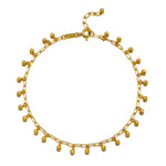 A beautiful Joyful Journey Anklet featuring delicate golden beads that create a soft, bell-like sound with every movement. This spiritual jewelry piece is perfect for meditation and serves as a meaningful talisman for manifestation. Ideal for yoga practices and embodying the energy of the sun and moon, this anklet adds a touch of elegance and protection to your spiritual journey, embodying the essence of zodiac energies.