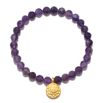 Crown Chakra Amethyst Stretch Bracelet featuring faceted amethyst gemstones and an 18kt gold plated charm. This spiritual jewelry piece enhances meditation and serves as a powerful talisman for spiritual growth, consciously manifesting positive energy with its unique meaning. Ideal for yoga enthusiasts and those seeking protection and inspiration, perfect for zodiac enthusiasts.