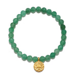 Beautiful Heart Chakra Aventurine Stretch Bracelet made from faceted green aventurine beads, featuring an 18kt gold plated heart chakra symbol charm. This spiritual jewelry piece is perfect for meditation and serves as a meaningful talisman for balance and creativity, enhancing your yoga practice and protection during spiritual rituals.