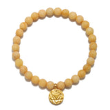 Solar Plexus Chakra Yellow Jade Stretch Bracelet featuring a unique arrangement of yellow jade beads and a gold charm, representing spiritual growth. An ideal accessory for meditation, protection, and meaningful connection during yoga.