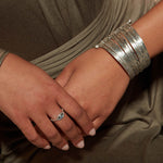 Silver Large Bangle Bracelet Cuff - Something Special showcased on a model’s wrist, capturing the essence of spiritual jewelry. This stunning cuff combines the allure of multiple bangles while symbolizing meaning and mindfulness, perfect for meditation, yoga, or as a talisman through zodiac energies.