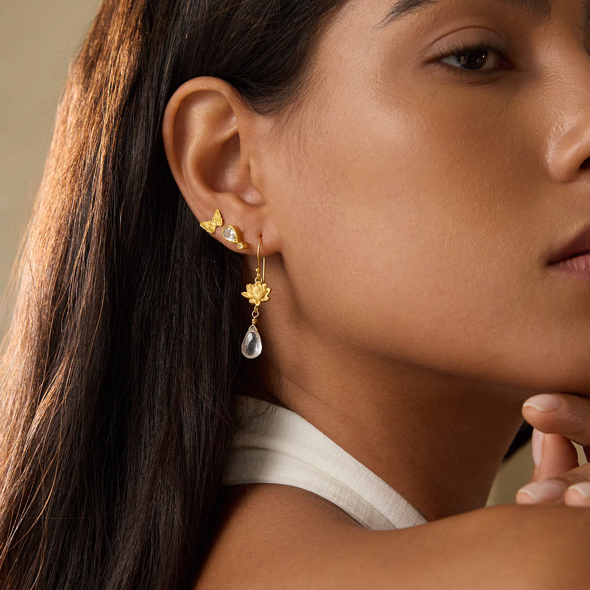 A model wearing True Self Green Amethyst Earrings, highlighting the elegance of spirituality and protection, perfect for those seeking talismans for emotional assurance and connection during meditation, sun, and moon rituals.