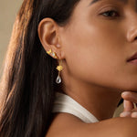 A model wearing True Self Green Amethyst Earrings, highlighting the elegance of spirituality and protection, perfect for those seeking talismans for emotional assurance and connection during meditation, sun, and moon rituals.