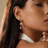 A model wearing True Self Green Amethyst Earrings, highlighting the elegance of spirituality and protection, perfect for those seeking talismans for emotional assurance and connection during meditation, sun, and moon rituals.