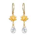 Spiritual Journey Lotus Crystal Earrings showcasing delicate gold lotus flowers and clear crystal drops, a perfect talisman for protection and meditation. This spiritual jewelry is meaningful for yoga and manifestation enthusiasts.