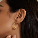 Close-up of the Courageous Spirit Earrings showcasing their 18kt gold plated design, featuring a bold bead and delicate rope detail. These earrings are perfect for those seeking spiritual jewelry for meditation and manifestation, embodying protection and meaningful connections to the sun and moon.