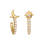 Scattered Stardust Celestial Moon and Star Pavé Hoop Earrings featuring shimmering pavé white topaz set in 18kt gold plating. This spiritual jewelry embodies the essence of protection, manifestation, and the energy of the sun and moon, perfect for meditation and yoga lovers.