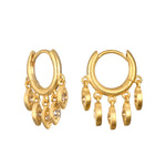 Scatter Light Huggie Earrings showcasing shimmering white topaz stones in an elegant design. These spiritual jewelry pieces symbolize clarity and openness, perfect for meditation and manifestation. Ideal for yoga enthusiasts and those seeking meaningful talismans inspired by the sun and moon.