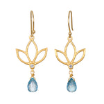 Ignite Renewal Blue Topaz Lotus Drop Earrings featuring a beautiful lotus design with sparkling blue topaz, perfect for those seeking spiritual jewelry. This meaningful piece symbolizes transformation and renewal, making it an ideal talisman for meditation and manifestation. Ideal for yoga enthusiasts and zodiac lovers, the earrings embody the essence of protection and harmony under the sun and moon.