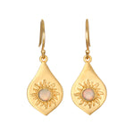 Pair of gold drop earrings with teardrop-shaped pendants featuring embossed sun designs and iridescent opal centers.