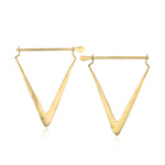Gold triangle-shaped hoop earrings with straight posts and rounded earring backs.