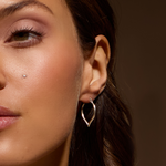 Close-up of a model wearing the Open to Possibilities Silver Earrings, showcasing a unique open work design inspired by lavender petals. These spiritual jewelry pieces symbolize new beginnings and infinite potential, perfect for meditation and personal meaning. Ideal for yoga practitioners and those seeking a meaningful charm for manifestation and protection.