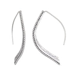 Embody Grace Lotus Petal Silver Earrings showcasing their elegant design with a unique curved shape, perfect for spiritual jewelry, meditation, and representing new beginnings. Ideal for yoga and meaningful manifestations.