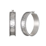 Bold Spirit Silver Hoop Earrings, crafted from sterling silver and featuring delicate beading, embody a timeless design perfect for everyday wear. These earrings are a beautiful piece of spiritual jewelry, enhancing your meditation practice and serving as a talisman for protection while resonating with the energy of the sun and moon. Ideal for those who appreciate meaningful adornments in their yoga journey.