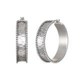 Bold Spirit Silver Hoop Earrings, crafted from sterling silver and featuring delicate beading, embody a timeless design perfect for everyday wear. These earrings are a beautiful piece of spiritual jewelry, enhancing your meditation practice and serving as a talisman for protection while resonating with the energy of the sun and moon. Ideal for those who appreciate meaningful adornments in their yoga journey.