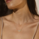 A model wearing the Commence with Clarity White Topaz Lotus Petal Necklace, embodying spiritual jewelry and representing new beginnings, meditation, and clarity. This meaningful piece serves as a talisman for transformation, connecting to the themes of manifestation and protection, perfect for yoga enthusiasts.