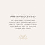 A visual of the Satya Foundation initiative that accompanies the Aligned in Purpose Chakra Necklace, emphasizing the impact of each purchase. This aligns with spiritual jewelry missions for meditation, mantra, and yoga, promoting meaningful giving and symbolic contributions to manifestation and sacred meanings.