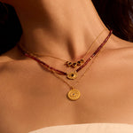 Close-up of the Internal Fire Garnet Lotus Beaded Necklace with intricate details, ideal for those seeking meaningful accessories related to spirituality and zodiac connections.