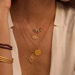 Gaining Clarity White Topaz and Mother of Pearl Hamsa Reversible Necklace showcased on a model, symbolizing spiritual jewelry and protection, perfect for meditation and meaningful manifestation in daily life. This elegant piece blends with zodiac and yoga themes, enhancing your spiritual journey.