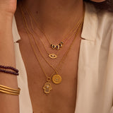 Gaining Clarity White Topaz and Mother of Pearl Hamsa Reversible Necklace showcased on a model, symbolizing spiritual jewelry and protection, perfect for meditation and meaningful manifestation in daily life. This elegant piece blends with zodiac and yoga themes, enhancing your spiritual journey.