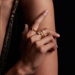 Close-up of a model wearing the Illuminated Spirit Moon Sun Adjustable Ring along with other elegant spiritual jewelry, highlighting the connection to yoga, mindfulness, and the symbolism of the sun and moon as talismans for protection and spiritual growth.