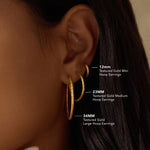 A comparison of Textured Gold Medium Hoop Earrings alongside other sizes, illustrating their 23mm diameter. This image captures the essence of spiritual jewelry, perfect for adding depth to your meditation journey and enhancing your journey of manifestation, protection, and personal meaning.