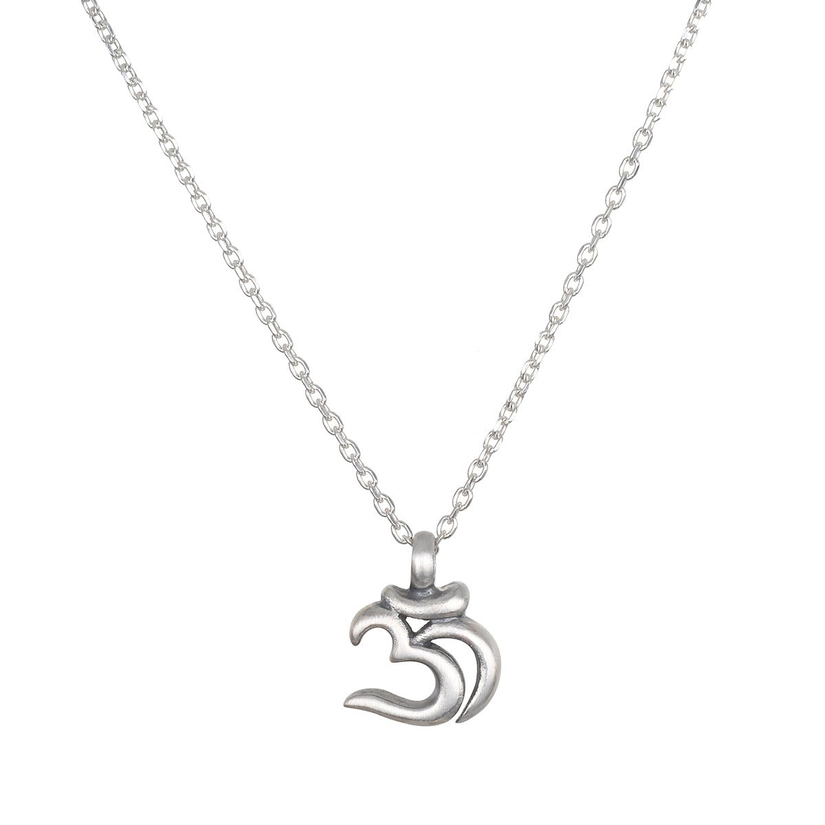 A silver necklace with a thin cable chain and a small matte Om symbol pendant hangs against a white background.