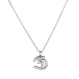 A silver necklace with a thin cable chain and a small matte Om symbol pendant hangs against a white background.