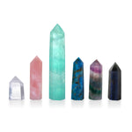 Fluorite Altar Crystal displayed among a variety of other natural gemstones, each symbolizing spiritual jewelry and meditation. This collection represents healing talismans ideal for zodiac rituals, malas, and yoga practices, enhancing spiritual protection and meaningful manifestation.