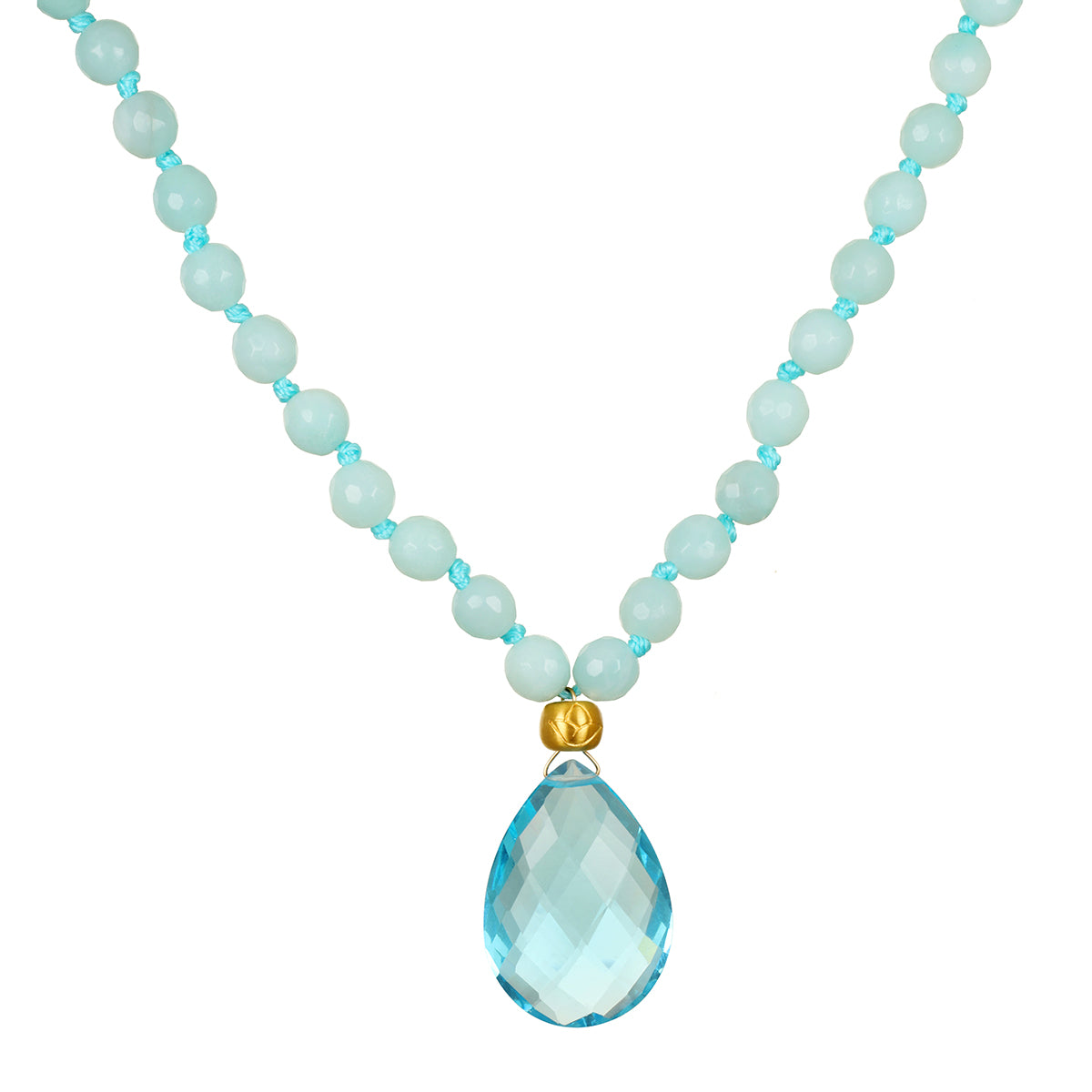 A necklace of faceted pale aqua beads knotted with turquoise cord, with a gold bead and a large teardrop blue gemstone pendant.