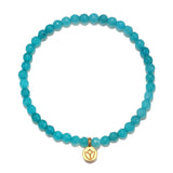 Courageous Beginnings Angelite Stretch Bracelet featuring a gold lotus flower charm, symbolizing new beginnings and infinite potential. This spiritual jewelry piece is perfect for meditation gifts, enhancing mantra practice, and supporting yoga routines. Made with angelite beads that embody truth and acceptance, it serves as a meaningful amulet and protective accessory for those seeking a deeper connection in their spiritual journey.