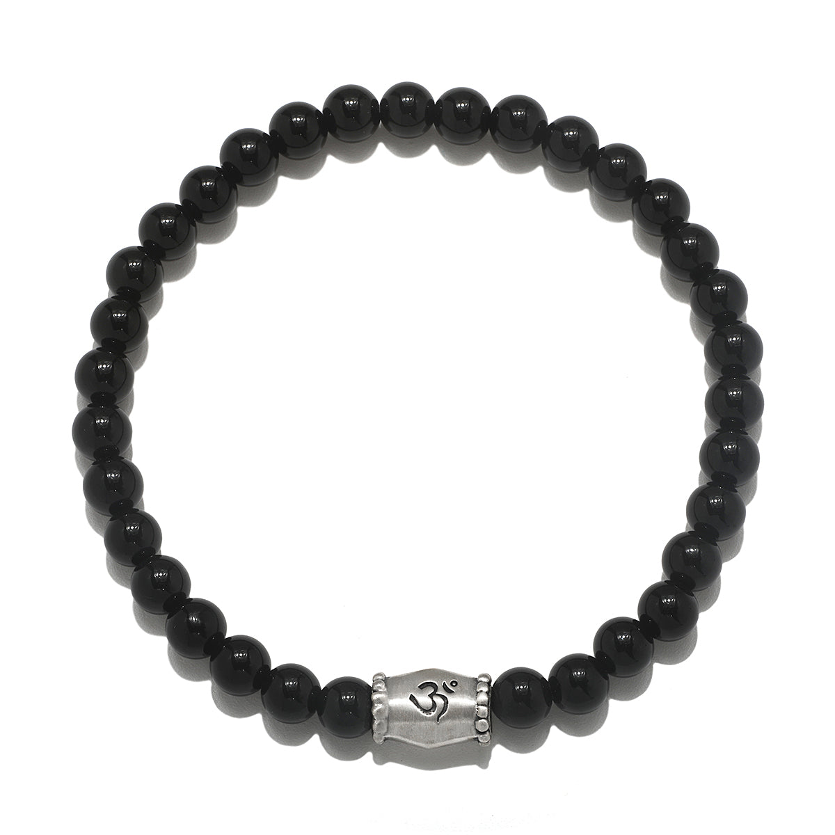 Extended Journey Men's Black Onyx Bracelet featuring a silver 'om' charm, representing spiritual jewelry that enhances meditation and serves as a meaningful talisman. This bracelet is perfect for those seeking protection and harmony in their yoga practice and aligns with the energies of the sun and moon, making it a beautiful manifestation charm.