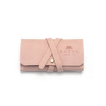 Weekend Journey Travel Jewelry Wrap Holder Pink, elegantly designed for spiritual jewelry. Made from soft microfiber, this holder protects your meaningful talismans like zodiac malas, providing a sense of yoga-inspired protection and manifestation while you travel.