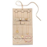 Inside view of the Journey Abroad Travel Wrap showcasing organized jewelry storage. This travel accessory from Satya Jewelry features multiple loops for necklaces and bracelets, perfect for spiritual adornments. Ideal for manifestation and protection, it keeps your meaningful talismans secure while reflecting the essence of the sun and moon.