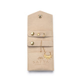 Interior view of the Overnight Journey Travel Jewelry Wrap showcasing organized sections for earrings and necklaces, designed to protect valuable spiritual jewelry such as talismans and zodiac symbols, enhancing your yoga and meditation journey.
