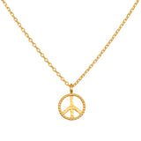 In Pursuit of Peace Necklace featuring a gold peace insignia on a delicate chain, embodying spiritual jewelry and meaning for meditation and manifestation.