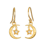 A pair of gold crescent moon drop earrings on hook wires, each with a small star set with a clear stone.