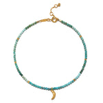 Moonlit Journey Turquoise Moon Anklet featuring vibrant turquoise beads and a golden crescent moon, symbolizing protection and nourishment. This piece embodies spiritual jewelry perfect for meditation and manifesting intentions, ideal for yoga enthusiasts who appreciate meaningful talismans.
